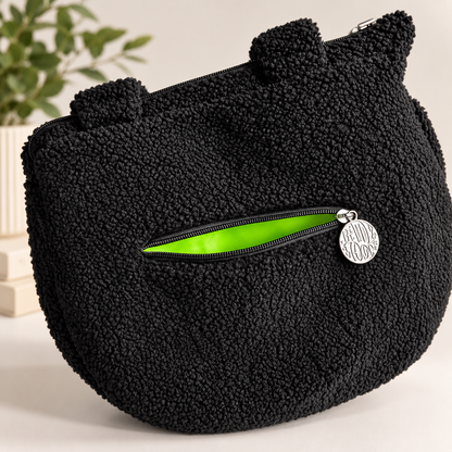 Cauldron crossbody bag interior view showing lining and pocket