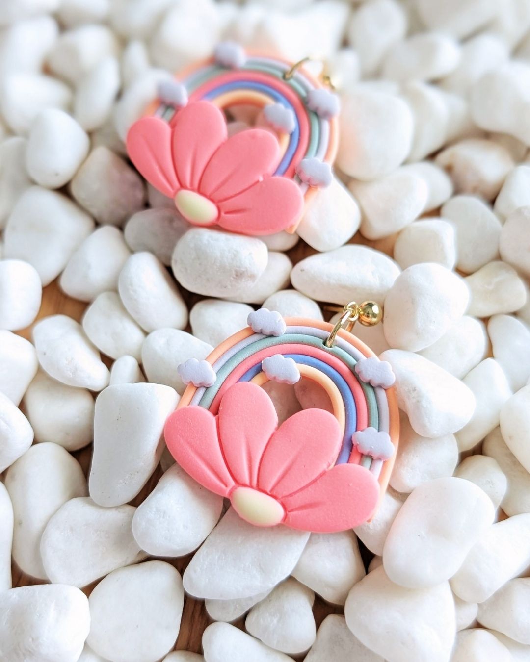 Handmade rainbow flower clay earrings by Thea and Grace front view showing colorful design