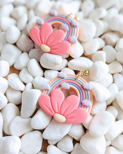 Handmade rainbow flower clay earrings by Thea and Grace front view showing colorful design