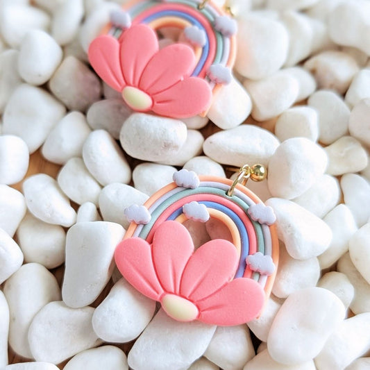 Handmade rainbow flower clay earrings by Thea and Grace front view showing colorful design