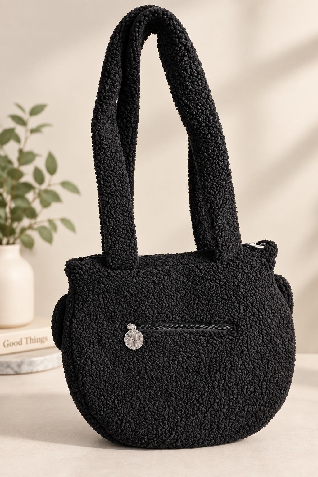 Cauldron crossbody bag styled on a shelf with fall decor
