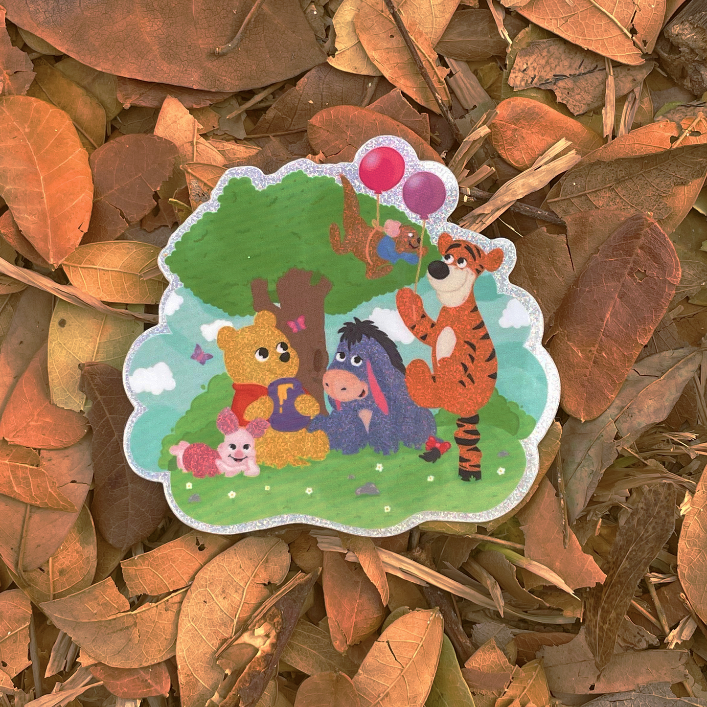 Winnie the Pooh and Friends pixie dust sticker held by hand – waterproof Disney vinyl